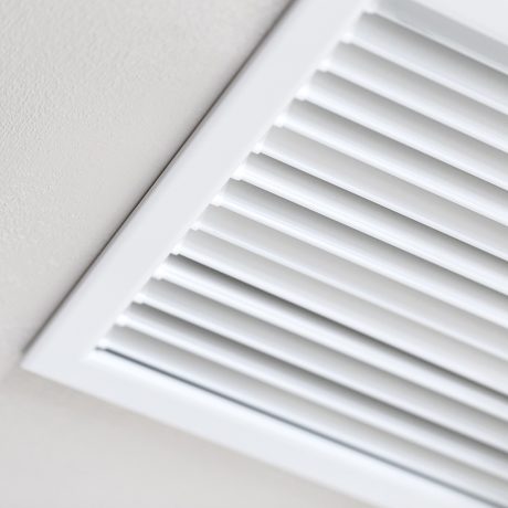 Office or Home Heating and Cooling Smart Vent for HVAC system Close up of vent on the wall. Plastic ventilation grid, piece of home ventilation system.